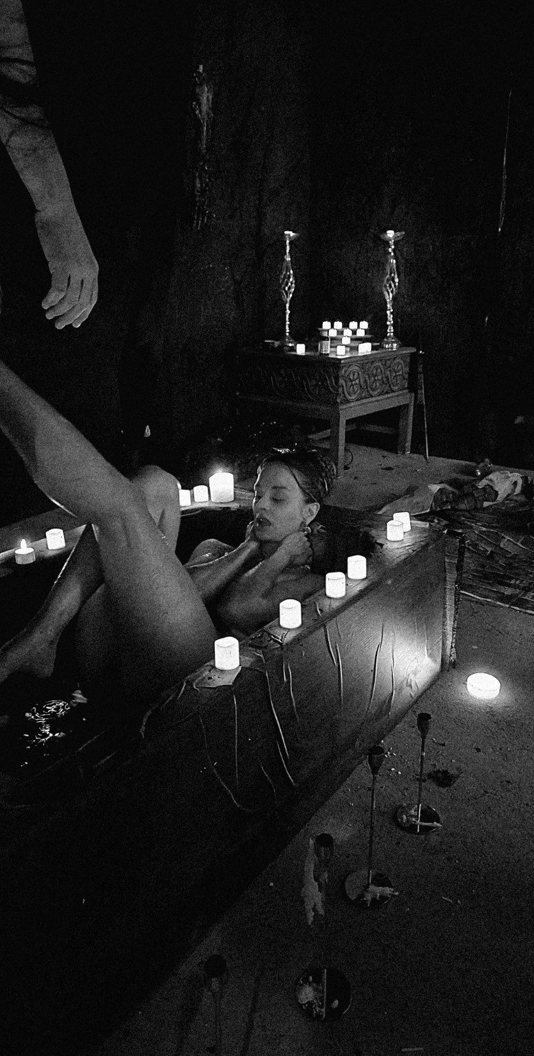 Black-and-white behind-the-scenes photograph from the BATHORY bathtub scene